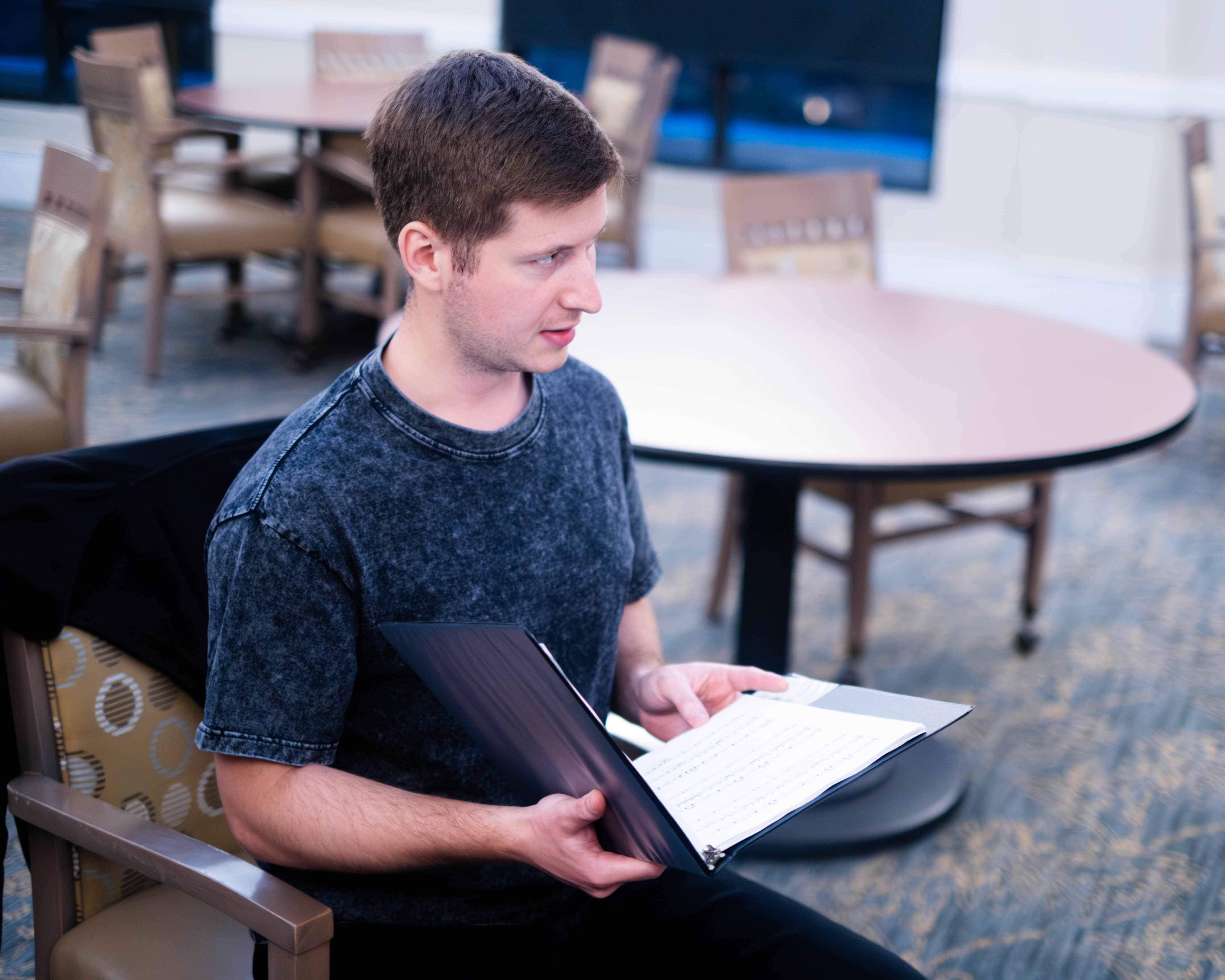 Choir member studying sheet music